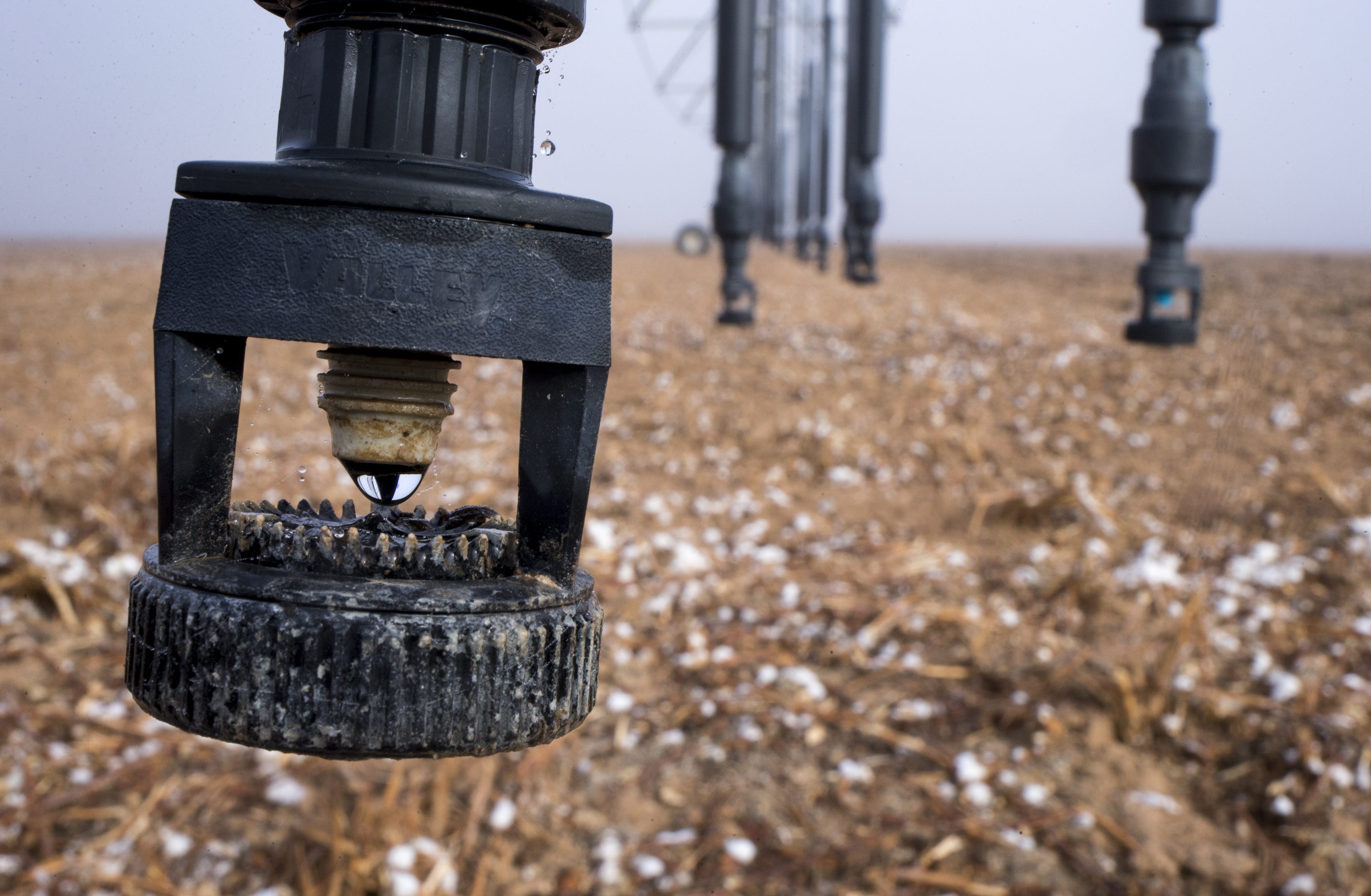 Water drips from a center-pivot sprinkler on a farm south of Maricopa, Arizona.