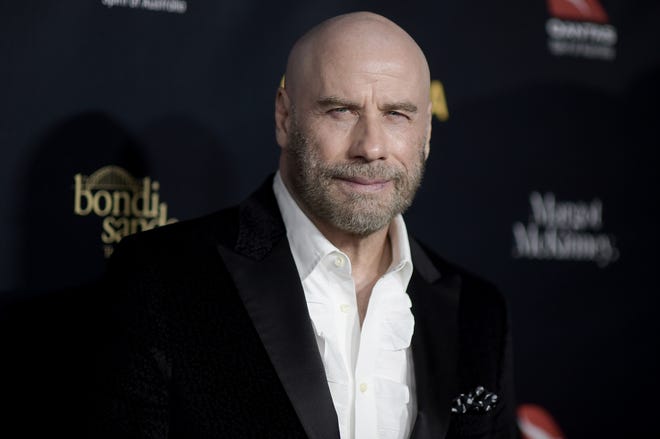 John Travolta and his bald head attend the 2019 G'Day USA Los Angeles Gala on Saturday.