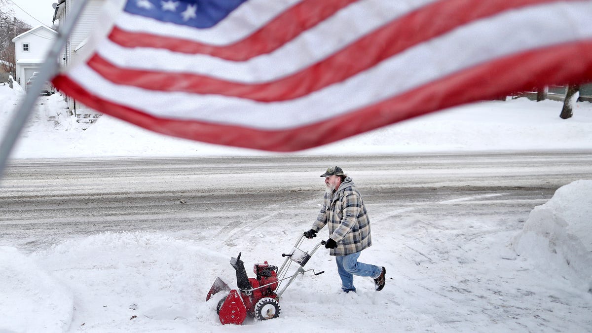 Jan White clears snow from his driveway Monday, Jan. 28, 2019, following a winter snowstorm that made its way through Janesville, Wis., overnight. Democratic Wisconsin Gov. Tony Evers declared a state of emergency shortly after noon Monday, citing the snow and severe cold that is forecast for the days ahead.