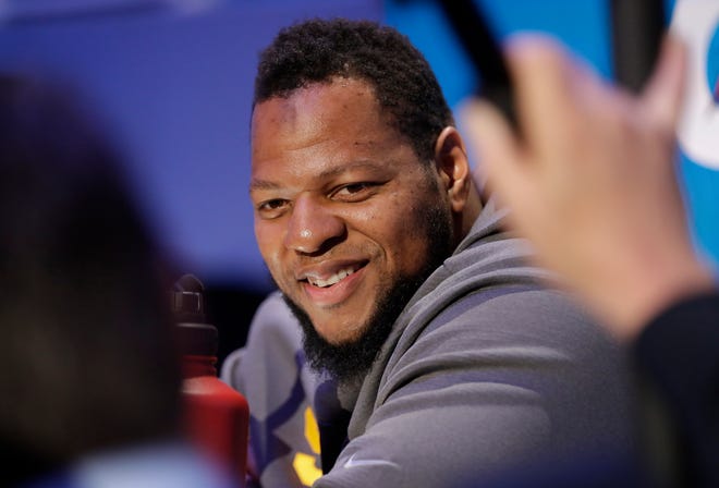 Former Lions defensive lineman Ndamukong Suh smiles during Opening Night for Super Bowl 53 on Monday in Atlanta.
