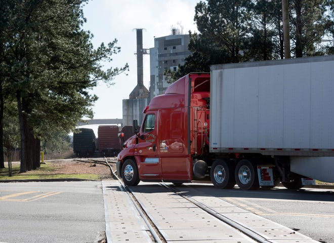Escambia County and CSX officials met Tuesday to address the problem of trains blocking roadways, such as this one at U.S. 29 and Muscogee Road in Cantonment, for hours at a time.
