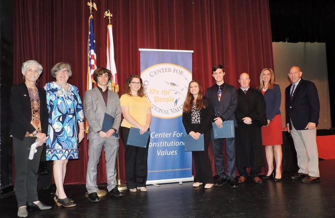 South Fork High School: Kate Boland, left, president of Center for Constitutional Values; Christa Li of Martin County School Board; contestants Dylan Dalal, Abby Gordon, Nicole Daly and Jeremy Ortmann; Judge Darren Steele, and Dr. Tracy Miller and Mark Malham of the School District.