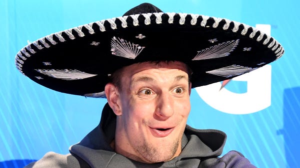 Rob Gronkowski wears a sombrero during Opening...