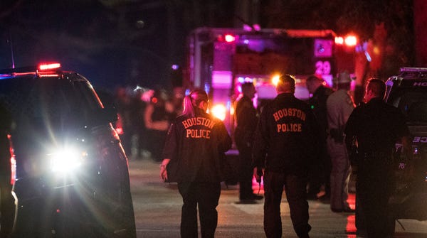 At least five Houston officers were injured in a...