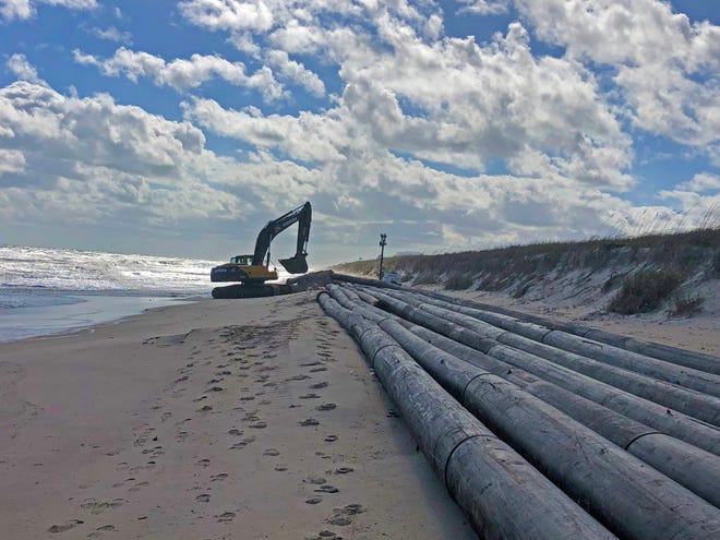 Pipe is being positioned on Indian River County beaches just south of Sebastian Inlet to carry sand dredged from the inlet’s sand trap for the Sebastian Inlet District’s ongoing dredging and beach renourishment project.
