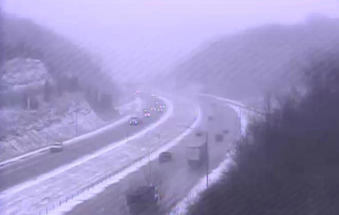 Snow is reducing visibility along I-275 in Kentucky Wednesday.
