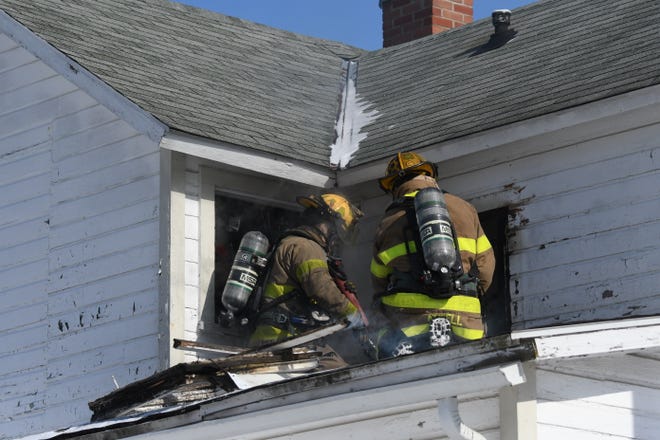 Mansfield firefighters battled a house fire Wednesday afternoon at the corner of Sixth Street and Sycamore Street.