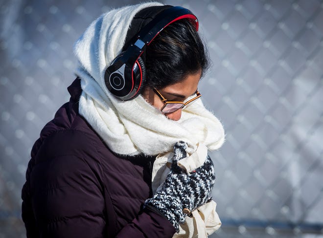 Pedestrians brave sub-zero temperatures near Ball State's campus Wednesday. 