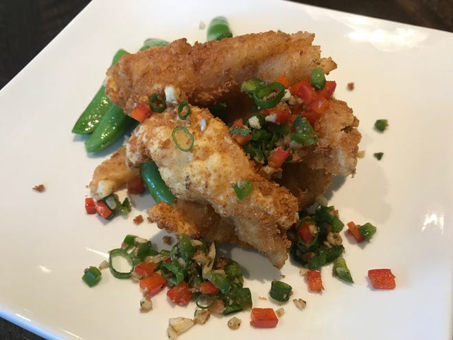 Five-spice sea bass and snow peas from Kwok's Bistro 2019 Chinese New Year dinner celebrating the Year of the Pig.