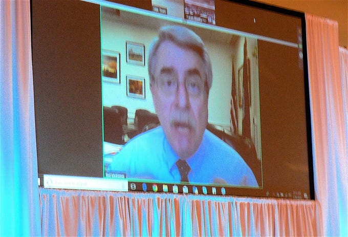USDA Under Secretary for Trade and Foreign Agricultural Affairs Ted McKinney discusses trade issues with Dairy Strong attendees via Skype.