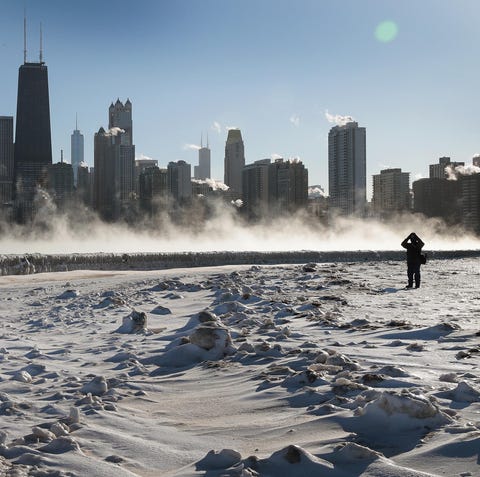 A visitor takes a picture of the Chicago skyline...