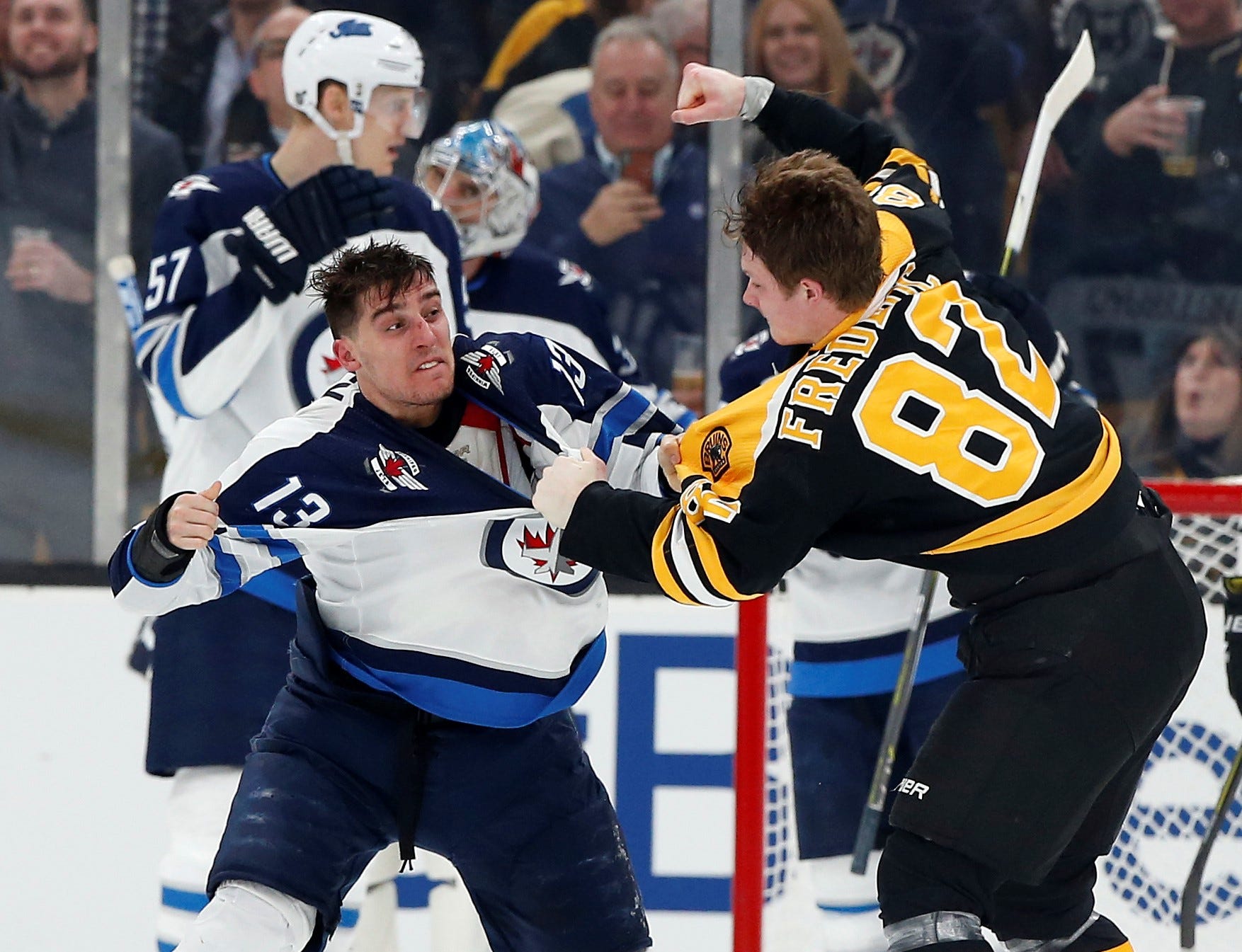 Bruins rookie Trent Frederic handily wins fight in NHL debut, and his parents are thrilled