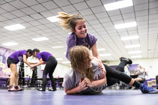 Glennin Hansen wrestles Abigail Fincher, both members of Relentless Wrestling, the first and only all-women's wrestling club in North Carolina, at Apple Valley Middle School in Hendersonville, Jan. 31, 2019.