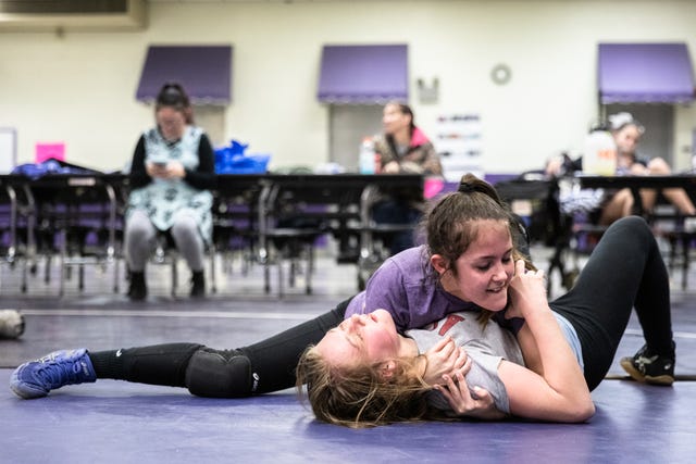 Glennin Hansen wrestles Abigail Fincher, both members of Relentless Wrestling, the first and only all-women's wrestling club in North Carolina, at Apple Valley Middle School in Hendersonville, Jan. 31, 2019.