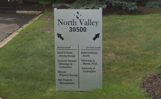 The entrance sign at 30500 Northwestern Hwy. in Farmington Hills, Mich., references the University of Farmington.