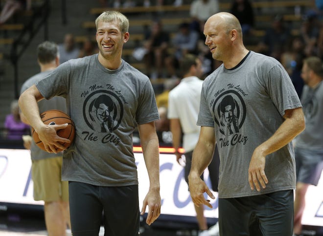 Robbie Hummel has a laugh with Brian Cardinal before the start of the Purdue Alumni basketball game Saturday, August 4, 2018, at Mackey Arena. The Black team defeated the Gold 101-91.