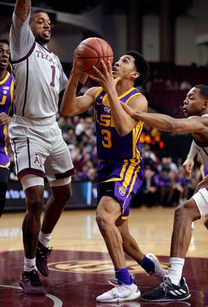 LSU guard Tremont Waters (3) is fouled by Texas A&M guard TJ Starks, right, as he drives past guard Savion Flagg (1) to the basket during the first half of an NCAA college basketball game Wednesday, Jan. 30, 2019, in College Station, Texas. (AP Photo/Michael Wyke)