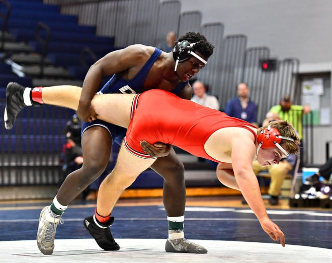 Dallastown's Jamal Brandon, back, wrestles Cumberland Valley's Connor Mundis in the 220 pound weight class during District 3, Class 3A wrestling action at Dallastown Area High School in York Township, Wednesday, Jan. 30, 2019. Dawn J. Sagert photo