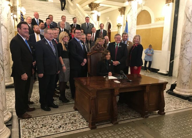 Gov. Kristi Noem poses for a photo with South Dakota legislators after the 'Constitutional carry' bill was signed into law Thursday.