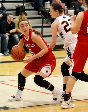 Fairfield Christian Academy's Hope Custer takes the ball to the basket during a recent game against Amanda-Clearcreek. The Knights earned the No. 1 seed  in Division IV at the tournament draw.