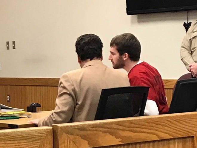 James Bonam, 23, with his attorney Bill McCririe in Livingston County Circuit Court Judge Michael Hatty's courtroom on Feb. 1, 2019.