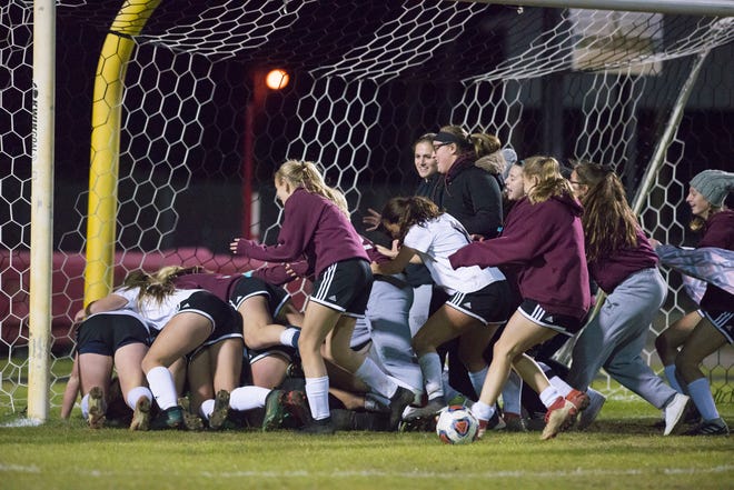 Niceville celebrates after winning the District 1-4A girls soccer tournament final between Niceville and Navarre at Navarre High School on Thursday, January 31, 2019.  Niceville won 7-6 in penalty kicks.
