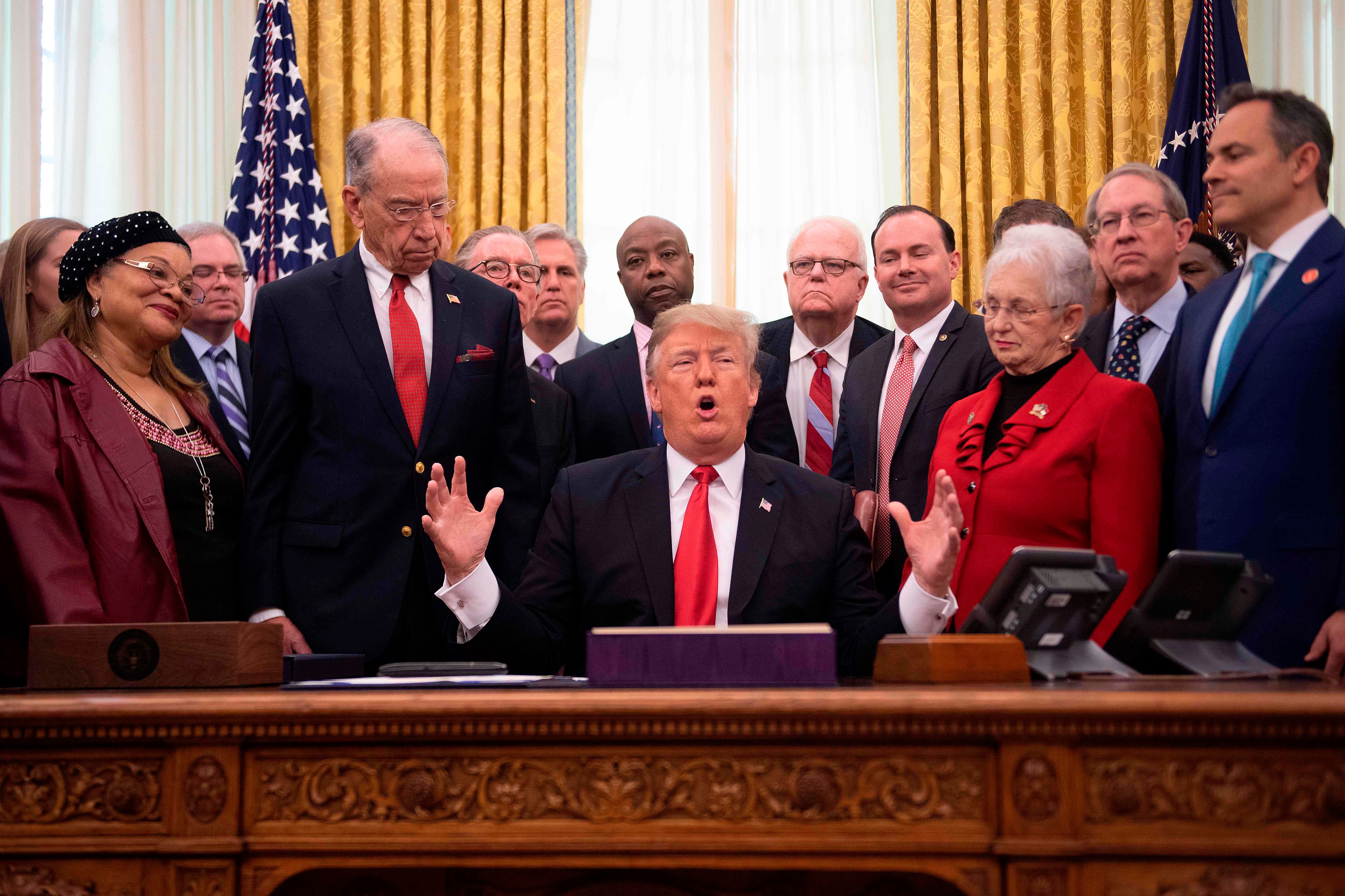 President Donald Trump speaks before signing the First Step Act and the Juvenile Justice Reform Act at the White House in Washington, DC, on December 21, 2018.