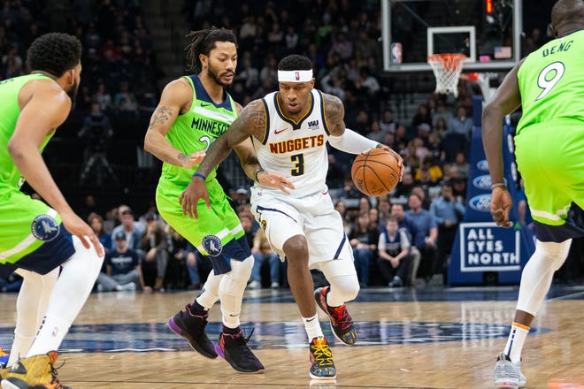 Torrey Craig, shown dribbling past Minnesota's Derrick Rose during a game Saturday night in Minneapolis, and the Denver Nuggets are on the road for three more games this week, beginning with a 5 p.m. contest Monday at Detroit.