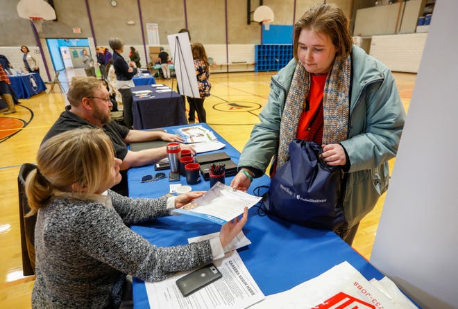 Kelsey Cotten, right, talks with Job Corps Outreach and Admissions Counselor Emily Nelms during the Point in Time homeless county at the YMCA on Thursday, Jan. 31, 2019.