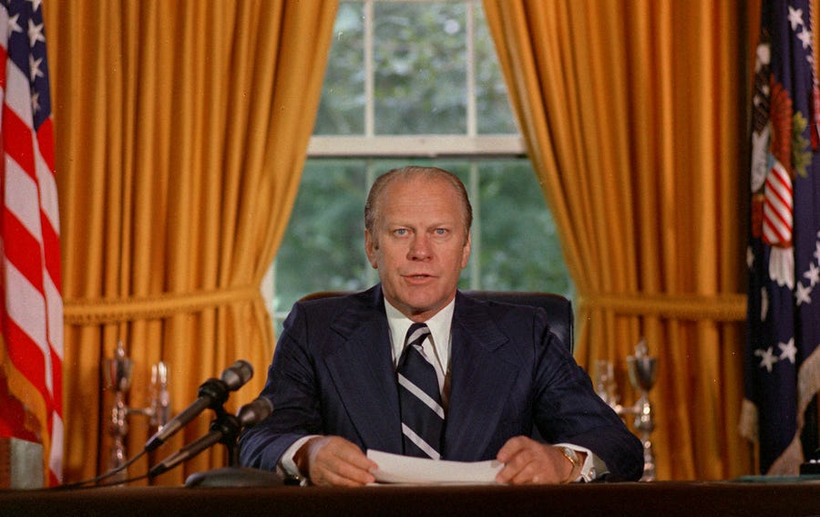 President Gerald Ford reads a proclamation pardoning Richard Nixon on Sept 8, 1974.