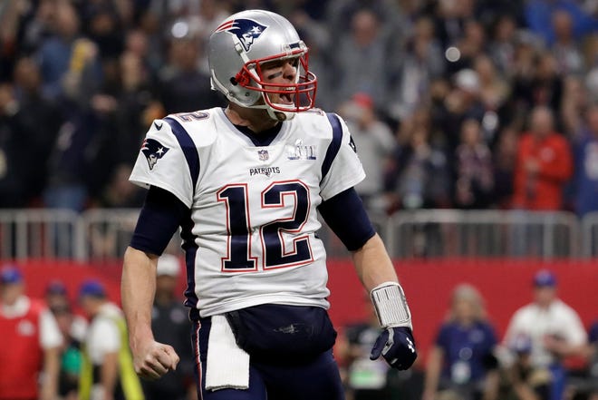 New England quarterback Tom Brady celebrates a touchdown during the second half.