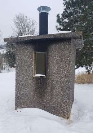 A fire was set to the exterior of the outhouse at Beavertail Pond Fishing Access Site.