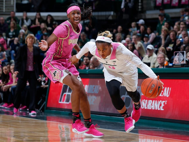 Michigan State's Shay Colley, right, drives against Purdue's Lyndsey Whilby, Sunday, Feb. 3, 2019, in East Lansing, Mich.