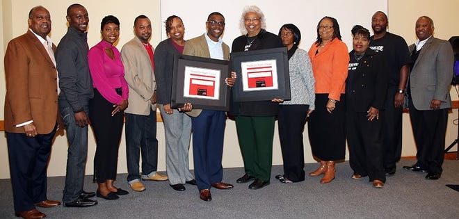 Pastor Darrick McGhee, Bible Based Church in Tallahassee (middle left), and Pastor Shirlean Thomas, Greenshade AME Church in Quincy (middle right), and their health leaders display plaques recognizing their churches for completion of the Health for Hearts United Program. Pastor Kennith Barrington, Metropolitan Cathedral of Truth in Havana (far left), and Pastor Tony Hannah, Greater St. James AME Church in Quincy (far right), who are members of the Health for Hearts United Pastors’ Advisory Council, made the presentations on behalf of the program.