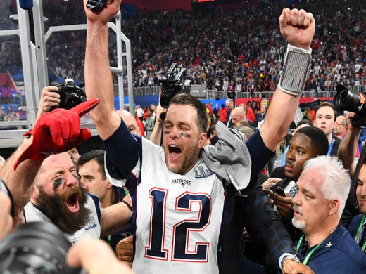 Tom Brady (12) celebrates after winning his record-breaking sixth Super Bowl.