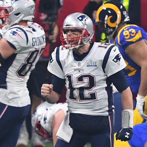Tom Brady celebrates after the Patriots scored...