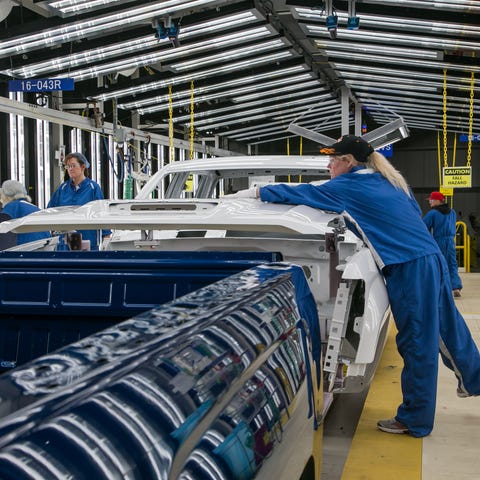Workers do final inspection at the Paint Shop at G