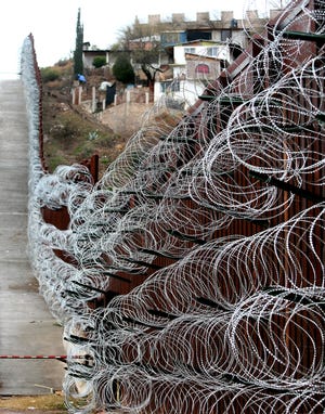 The additional concertina wire can be seen on the border fence in Nogales, Ariz, on February 4, 2019. U.S. Army troops were back in downtown Nogales over the weekend to add more coils of the wire.
