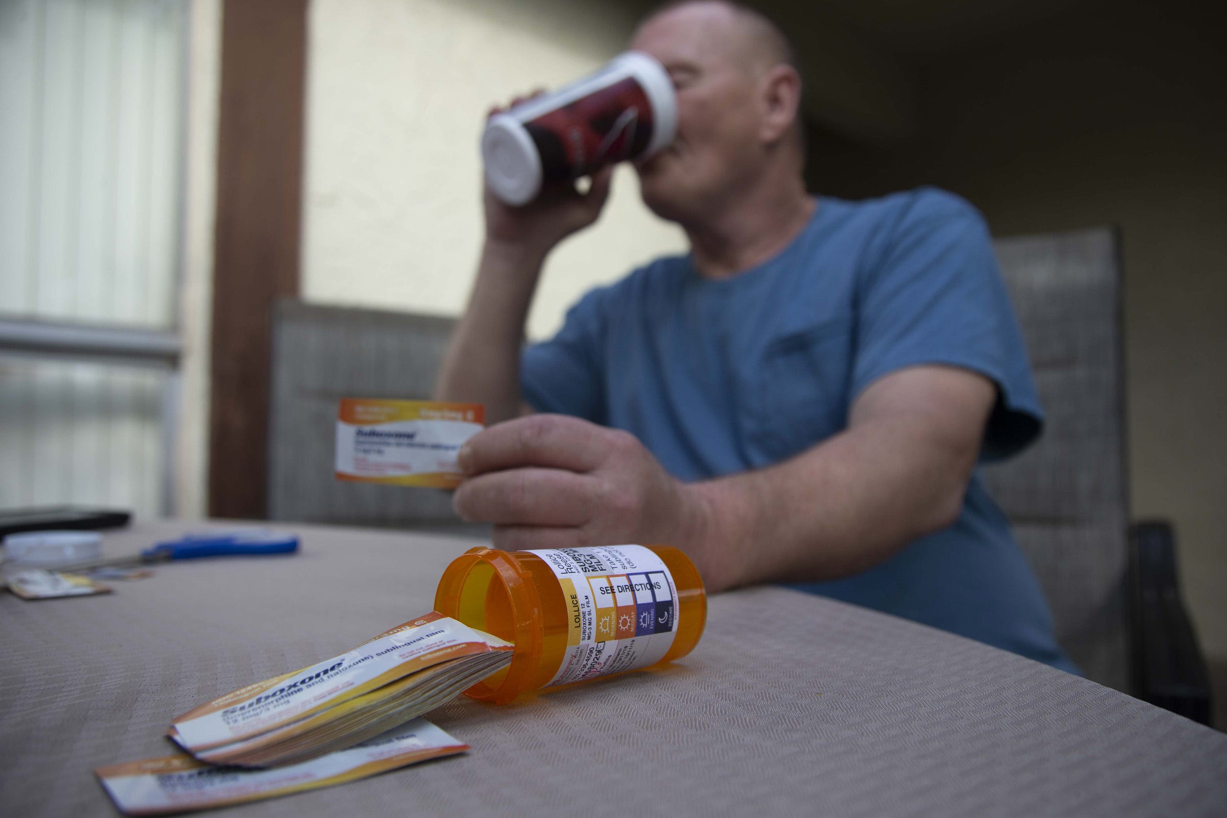 Lollice Reese, 54, takes his Suboxone before going to work. He is receiving medication-assisted treatment from Community Medical Services.
