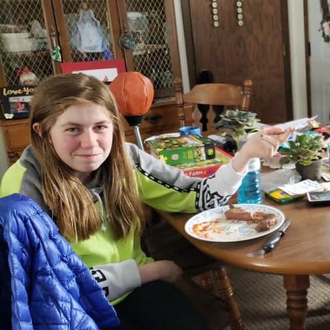 Jayme Closs eats a steak with her grandfather...