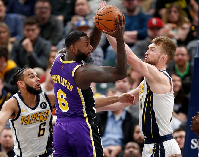 Los Angeles Lakers guard Lance Stephenson (6) looks to pass around Indiana Pacers forward Domantas Sabonis (11) in the second half of their game at Bankers Life Fieldhouse on Tuesday, Feb. 5, 2019. 