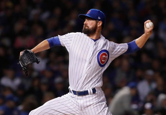 Cubs pitcher Cole Hamels throws a pitch against the Rockies during the 10th inning of the 2018 National League wild-card playoff game at Wrigley Field.