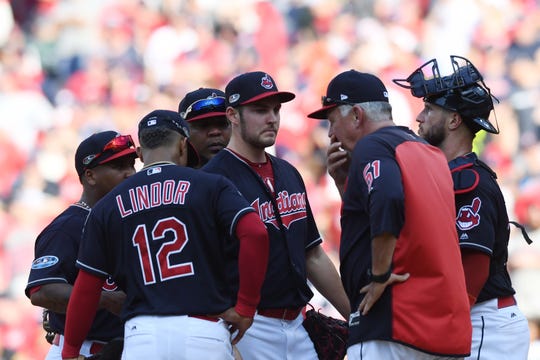 Indians pitching coach Carl Willis talks with starting pitcher Trevor Bauer during Game 3 of an American League division series against the Astros..