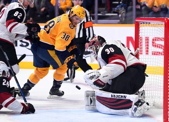 Feb 5, 2019; Nashville, TN, USA; Arizona Coyotes goaltender Calvin Pickard (30) makes a save on a shot by Nashville Predators right wing Ryan Hartman (38) during the first period at Bridgestone Arena. Mandatory Credit: Christopher Hanewinckel-USA TODAY Sports