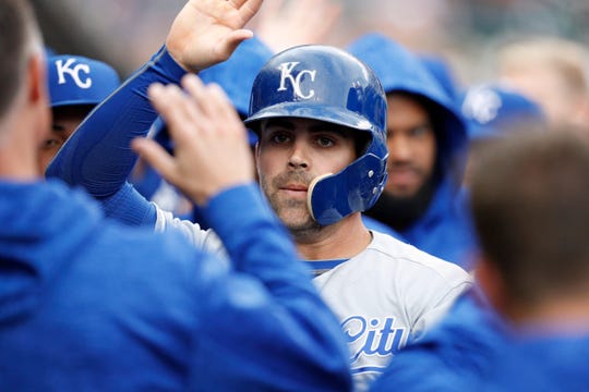Royals second baseman Whit Merrifield  celebrates with his teammates after scoring a run against the Tigers during a game at Comerica Park.