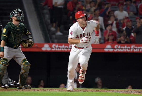 Angels center fielder Mike Trout follows his two-run home run against the Athletics at Angel Stadium of Anaheim.