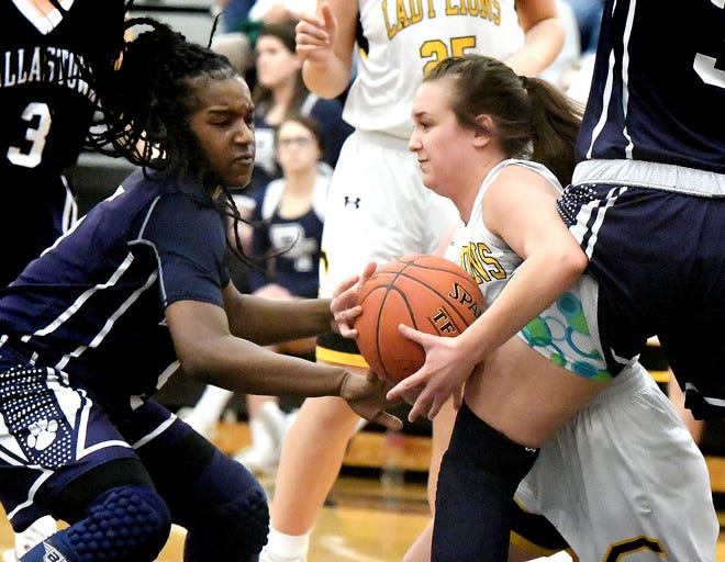 Dallastown's D'Shantae Edwards, left, and Samantha Miller stop Red LIon's Riley Miller during basketball action at Red Lion Tuesday, Feb. 5, 2019. Bill Kalina photo