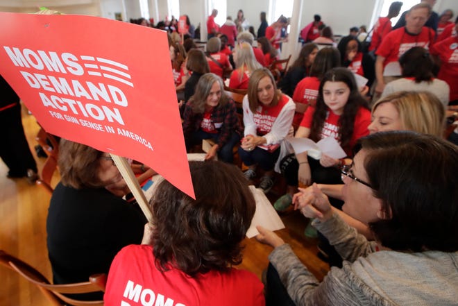 Tampa members of Moms Demand Action huddle up before departing for the Capitol where they would meet with lawmakers to lobby for stricter gun laws in Florida Wednesday, Feb. 6, 2019. 