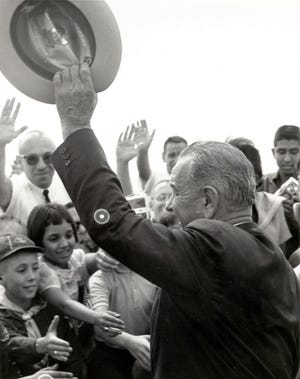 September 25, 1964 - President Lyndon Johnson waves to the crowd.