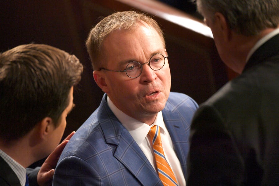 Mick Mulvaney, Director of the Office of Management and Budget, enters the chamber before President Donald Trump delivers the State of the Union address. 
